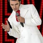 Elvis impersonator JD King in white If I Can Dream outift